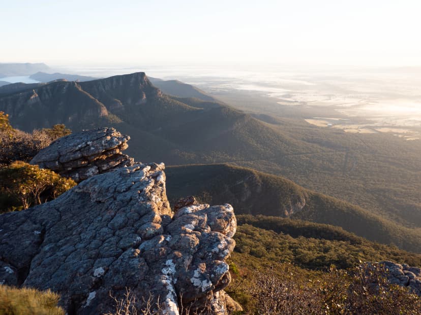 Watch the sun rise from the rocks of Mount William